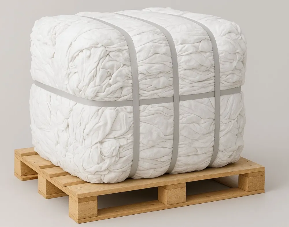 Compressed bale of about 1,000 lb of wiping rags, strapped on a wooden pallet